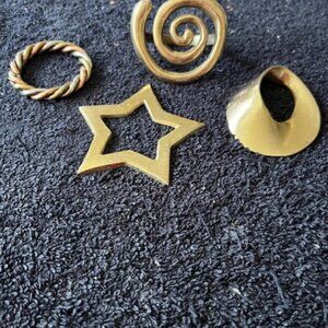 set of 4 unique shaped brass napkin rings
